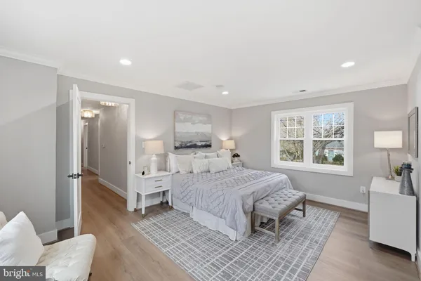 a living room with furniture and painting on the wall