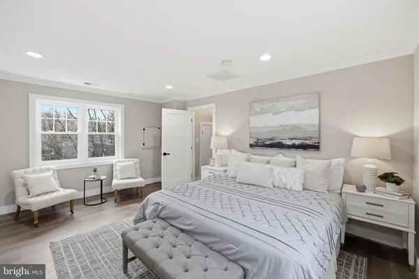 a view of a livingroom with furniture and wooden floor