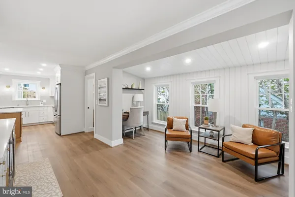 a kitchen with granite countertop a sink a counter top space stainless steel appliances and cabinets
