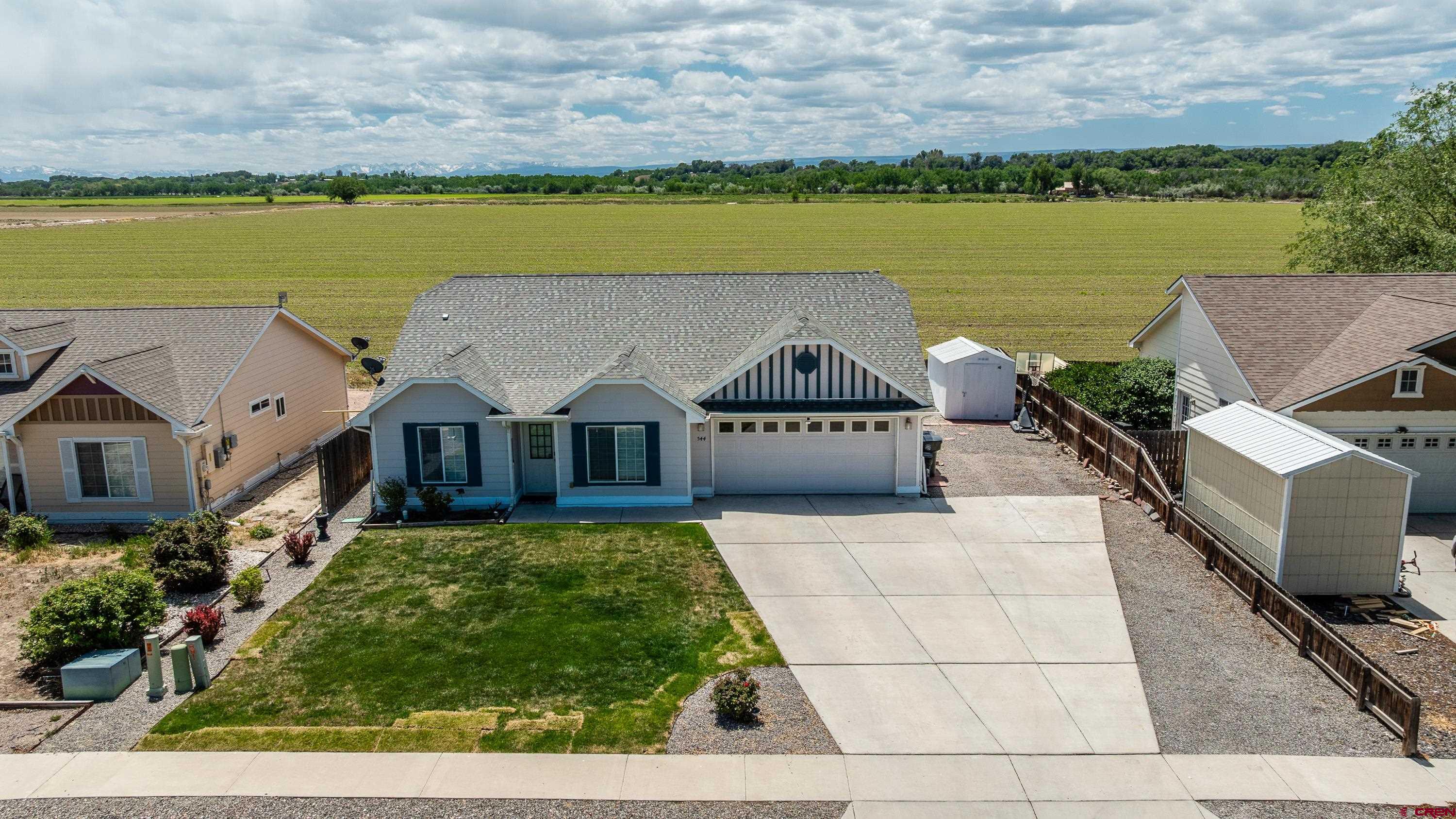 544 20th Street Delta, CO 81416 - Photo 3 of 44 an aerial view of a house with a lake view