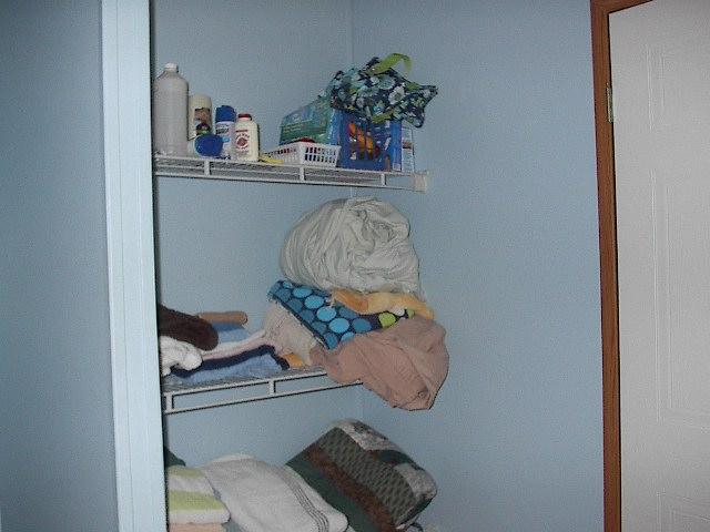 465 Storytown Road Hartsville, TN 37074 - Photo 10 of 16 Open linen closet in master bath