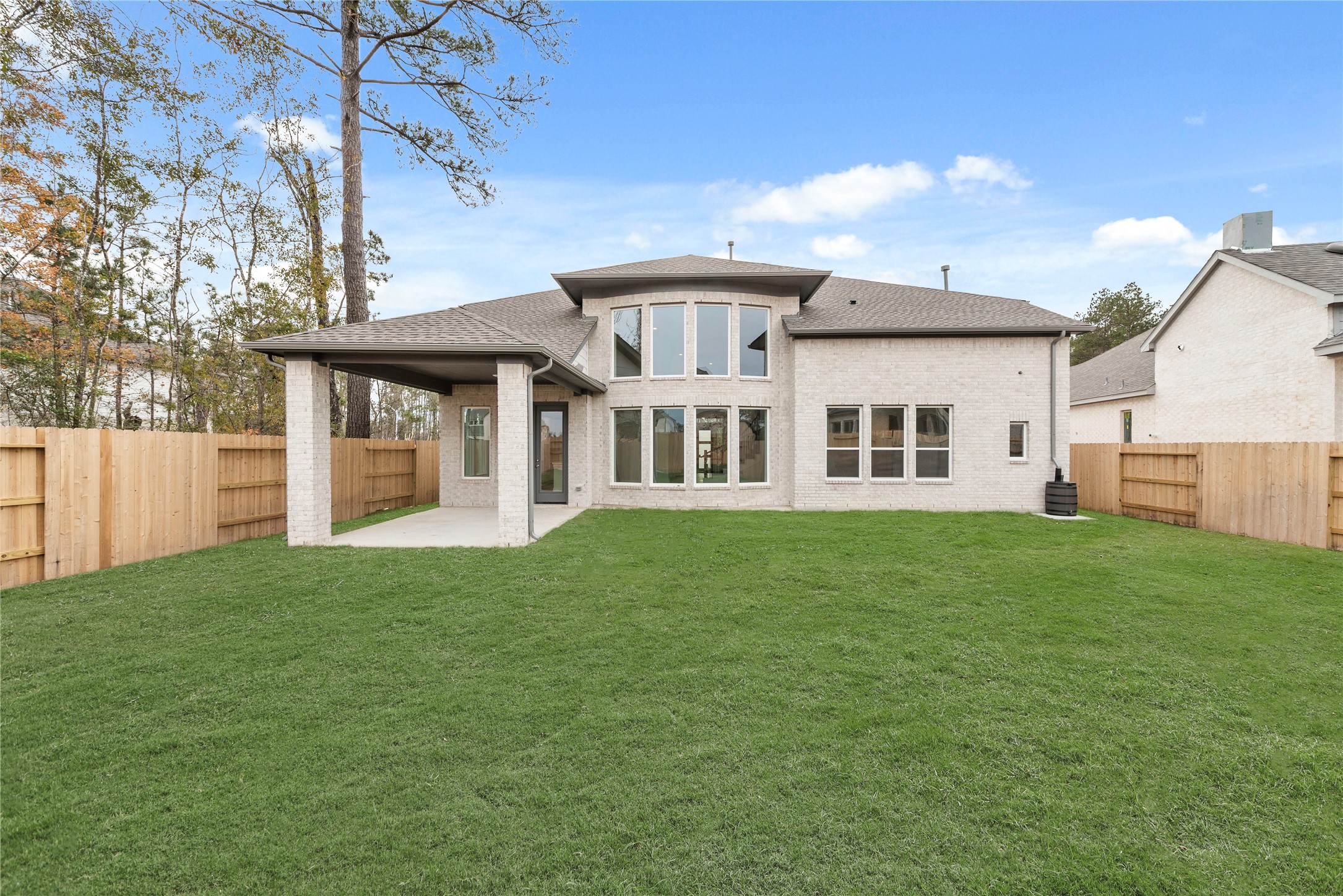 18917 Moonriver Street Conroe, TX 77302 - Photo 21 of 28 a view of a house with backyard and garden