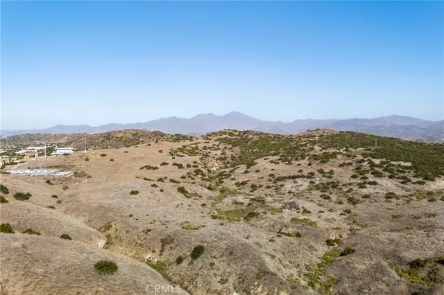 a view of room with wooden floor