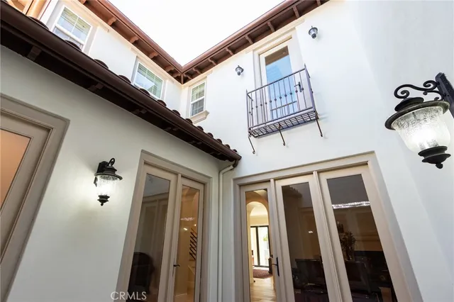 a view of a room with window and walk in closet with wooden floor