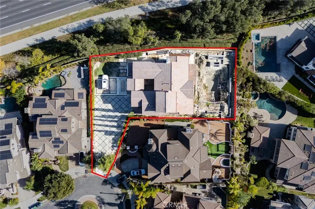 an aerial view of multiple houses with yard