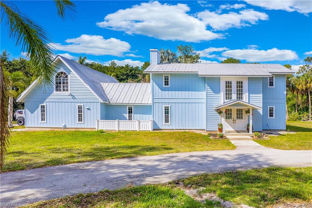 181 Weber Boulevard South Naples, FL 34117 - Photo 1 of 47 a view of a house with swimming pool and porch with furniture