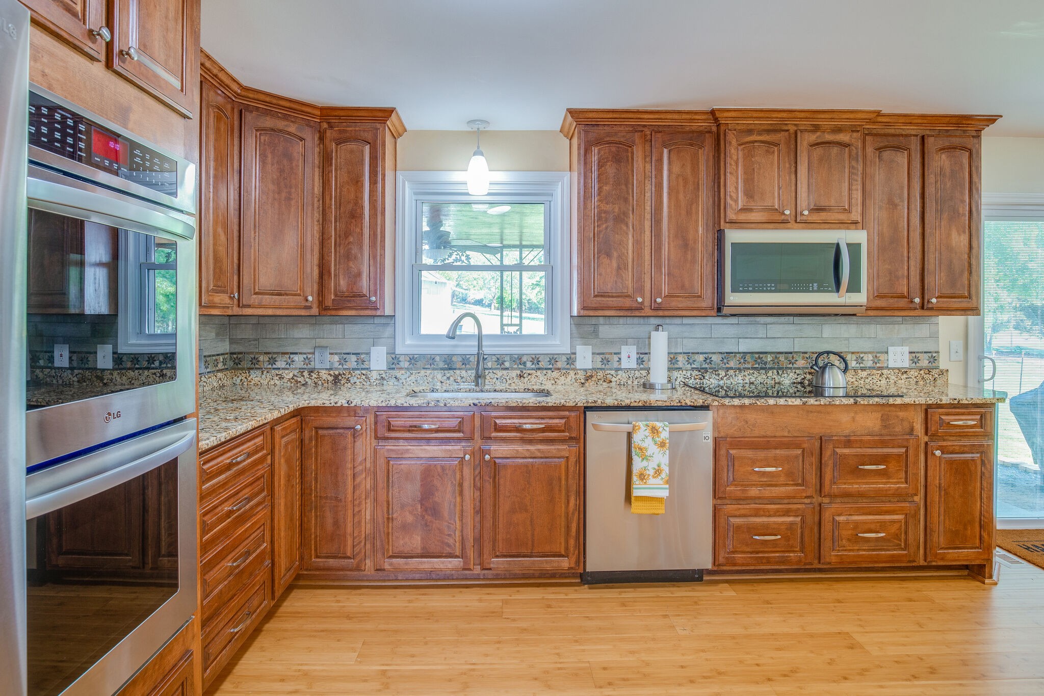 5111 Hickory Ridge Road Lebanon, TN 37090 - Photo 13 of 53 a kitchen with stainless steel appliances granite countertop wooden cabinets a stove and a sink