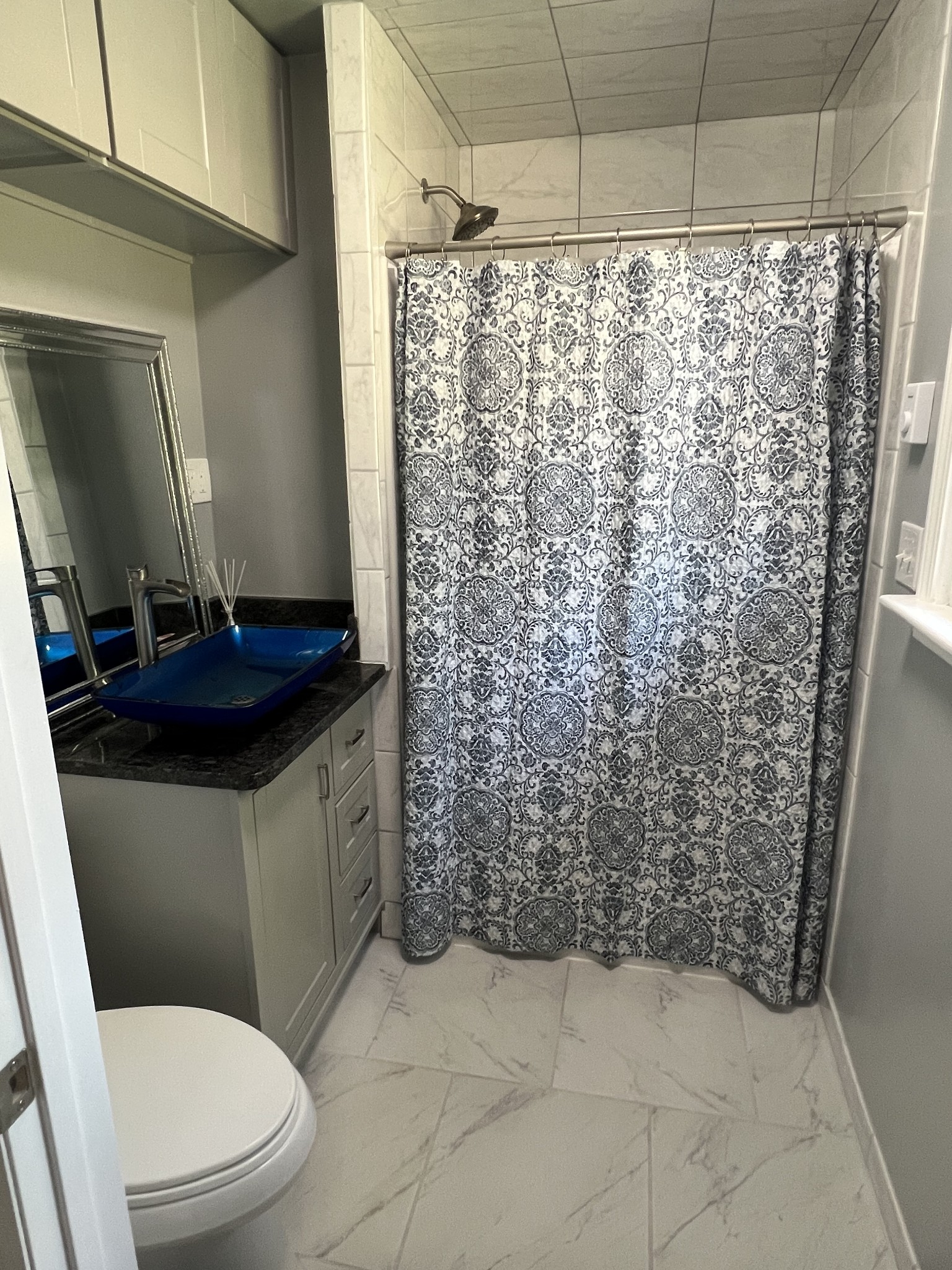 5111 Hickory Ridge Road Lebanon, TN 37090 - Photo 23 of 53 a bathroom with a granite countertop sink a toilet and shower