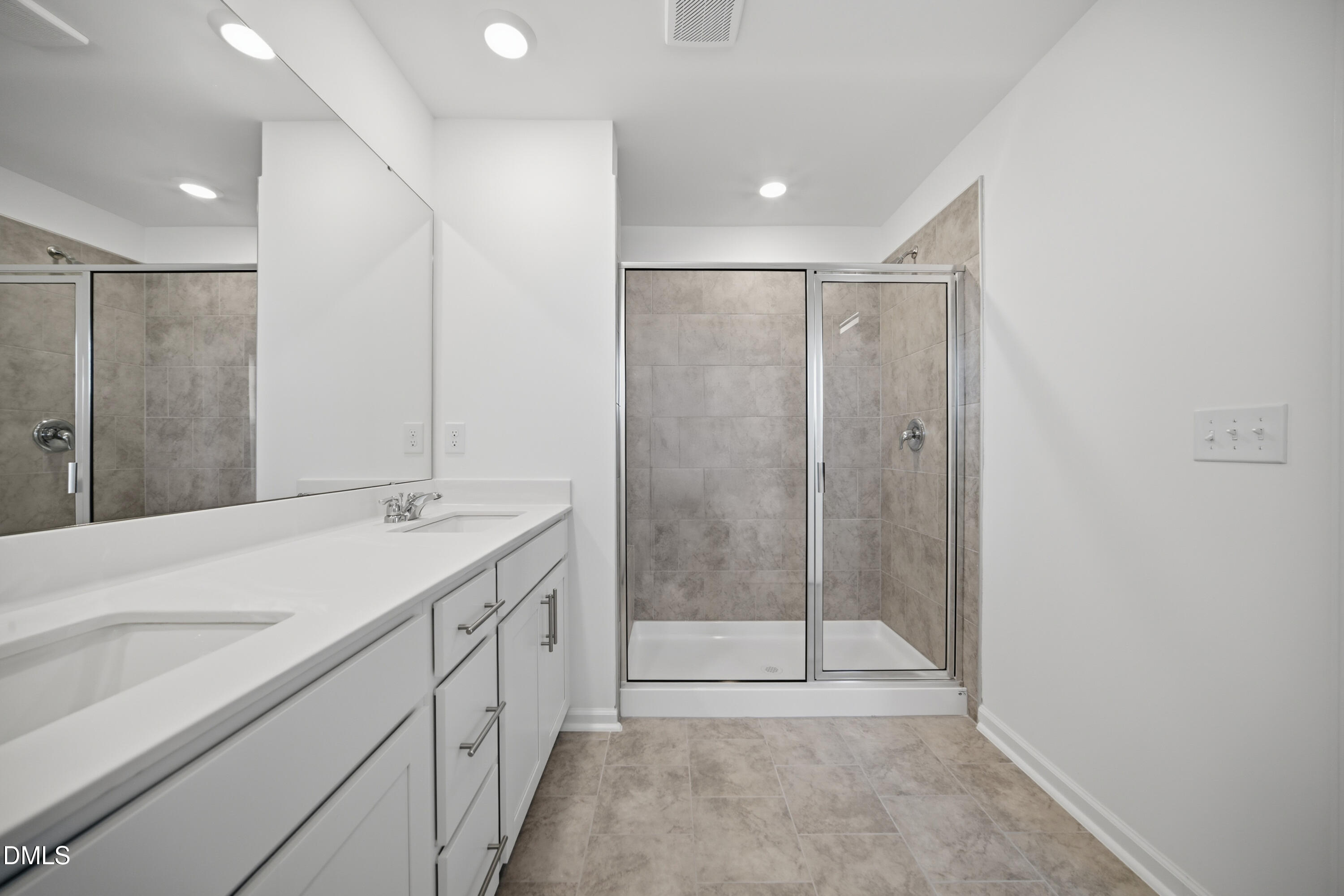 2915 Hickory Fld Drive Raleigh, NC 27616 - Photo 27 of 30 a bathroom with a sink a mirror and a shower