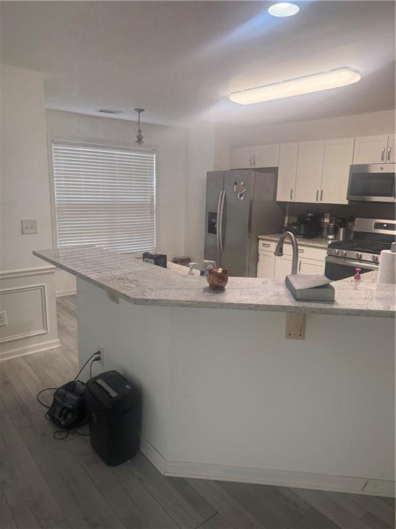 3282 Saville Street Southwest Atlanta, GA 30331 - Photo 6 of 13 a kitchen with stainless steel appliances granite countertop a sink and cabinets