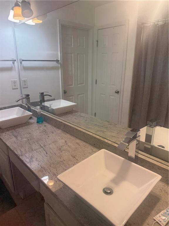 3282 Saville Street Southwest Atlanta, GA 30331 - Photo 7 of 13 a bathroom with a sink and a mirror