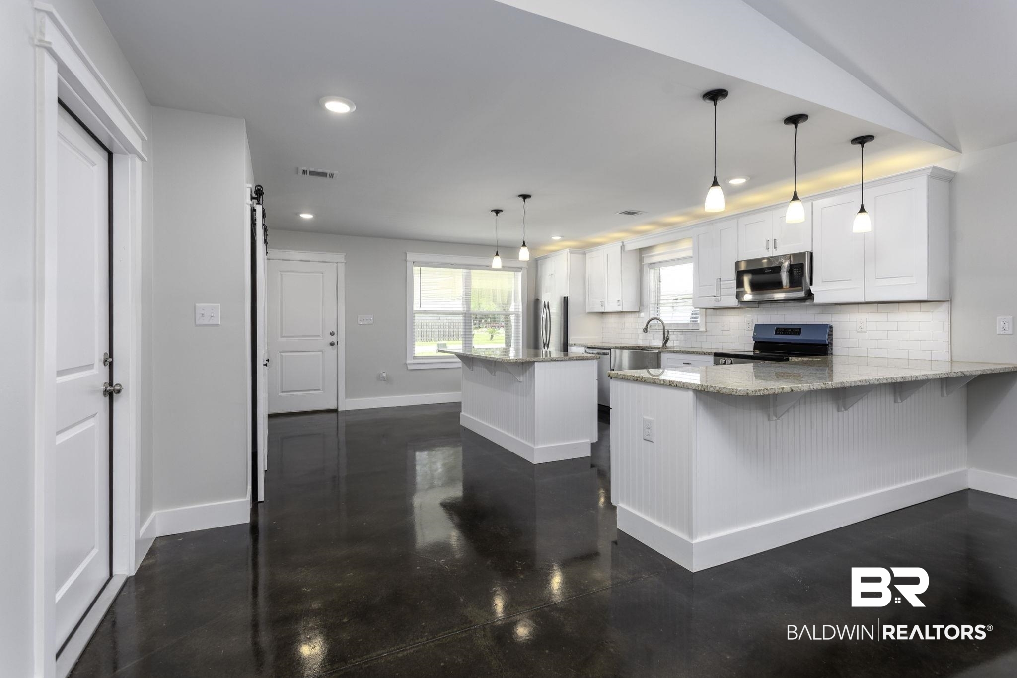 17126 Sugar Loop Foley, AL 36535 - Photo 7 of 28 Kitchen featuring stainless steel appliances, a peninsula, backsplash, white cabinetry, and recessed lighting