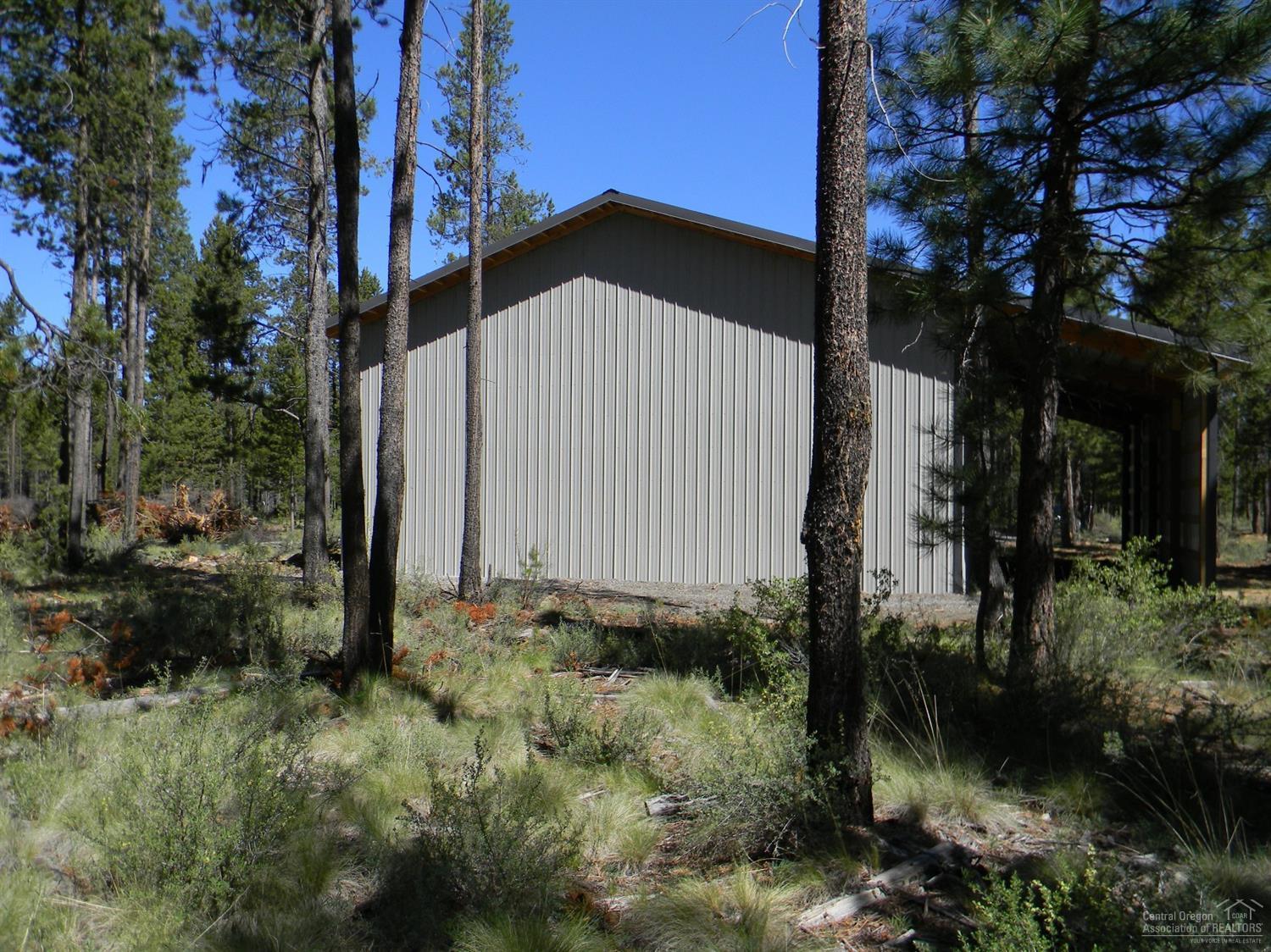 17145 Covina Road Bend, OR 97707 - Photo 5 of 9 a view of a house with a yard