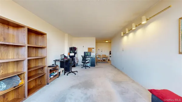 a view of a workspace with furniture