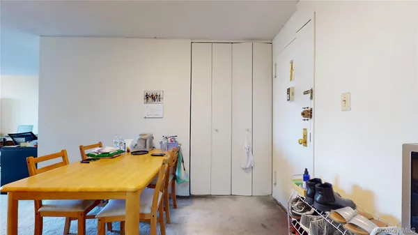 a room with a table and chairs