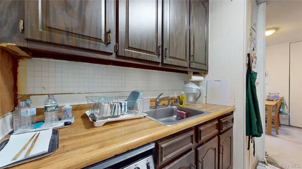 a kitchen with a sink cabinets and appliances