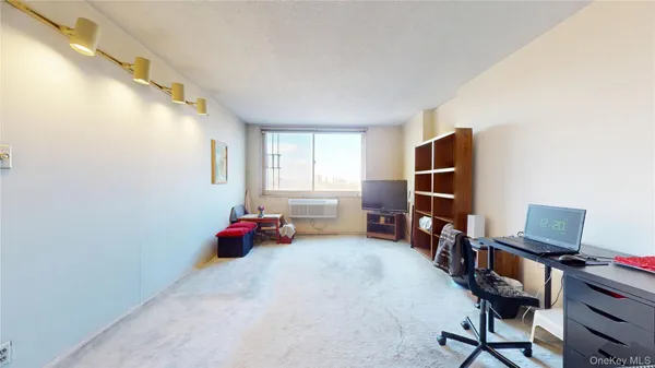 a bedroom with furniture and a window