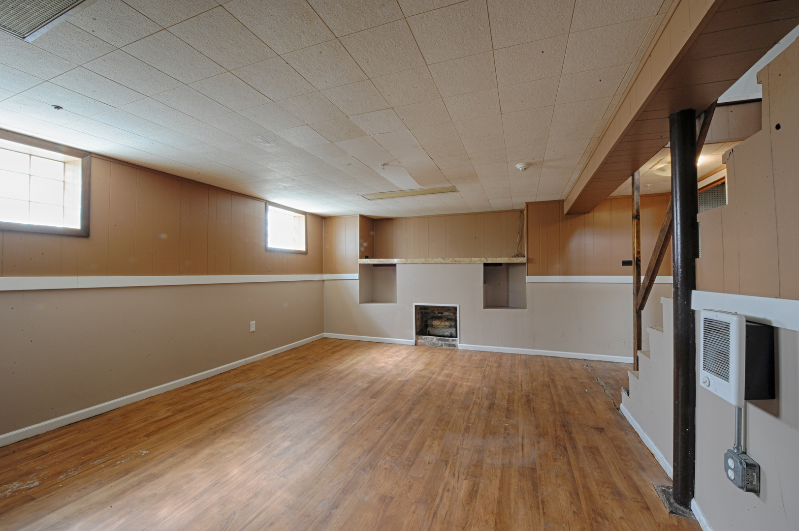 339 Clayton Road Hillside, IL 60162 - Photo 11 of 18 a view of empty room with wooden floor and fireplace