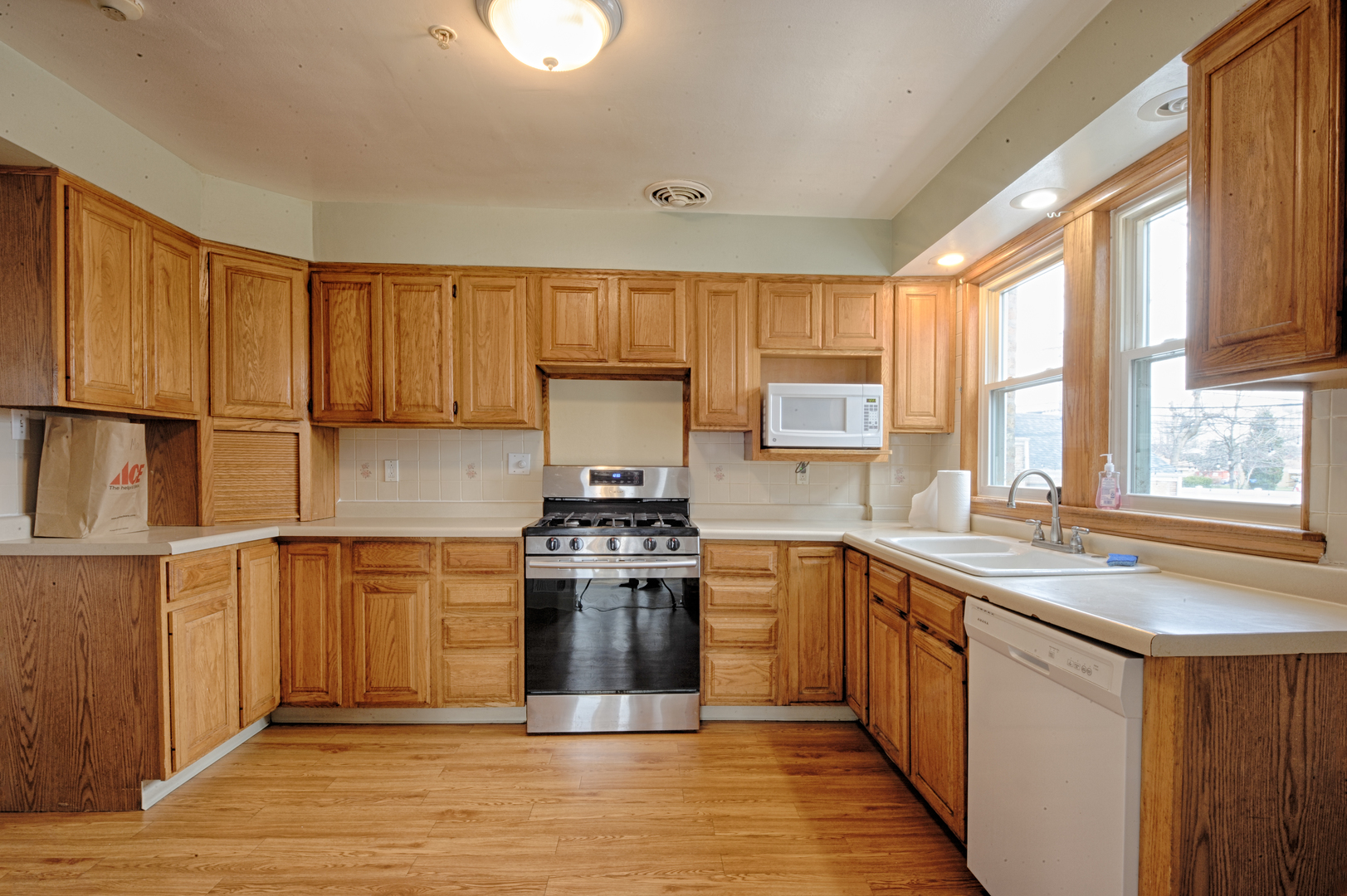 339 Clayton Road Hillside, IL 60162 - Photo 4 of 18 a kitchen with stainless steel appliances granite countertop a sink stove and refrigerator