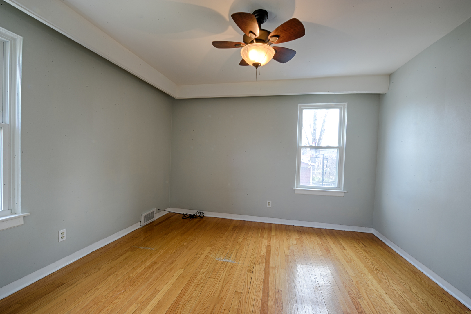339 Clayton Road Hillside, IL 60162 - Photo 7 of 18 an empty room with a window and a fan
