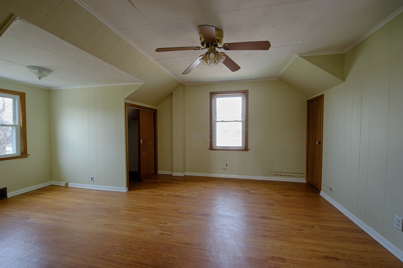 339 Clayton Road Hillside, IL 60162 - Photo 9 of 18 a view of an empty room with wooden floor and a window