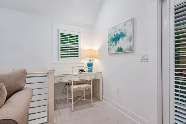 a kitchen with white cabinets and appliances