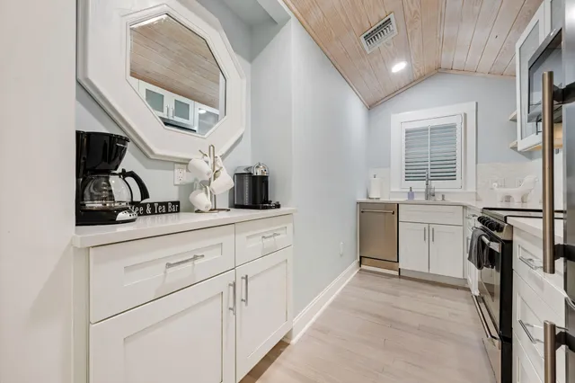 a kitchen with a sink and a microwave
