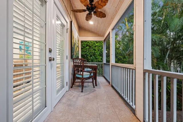 a view of a balcony with furniture