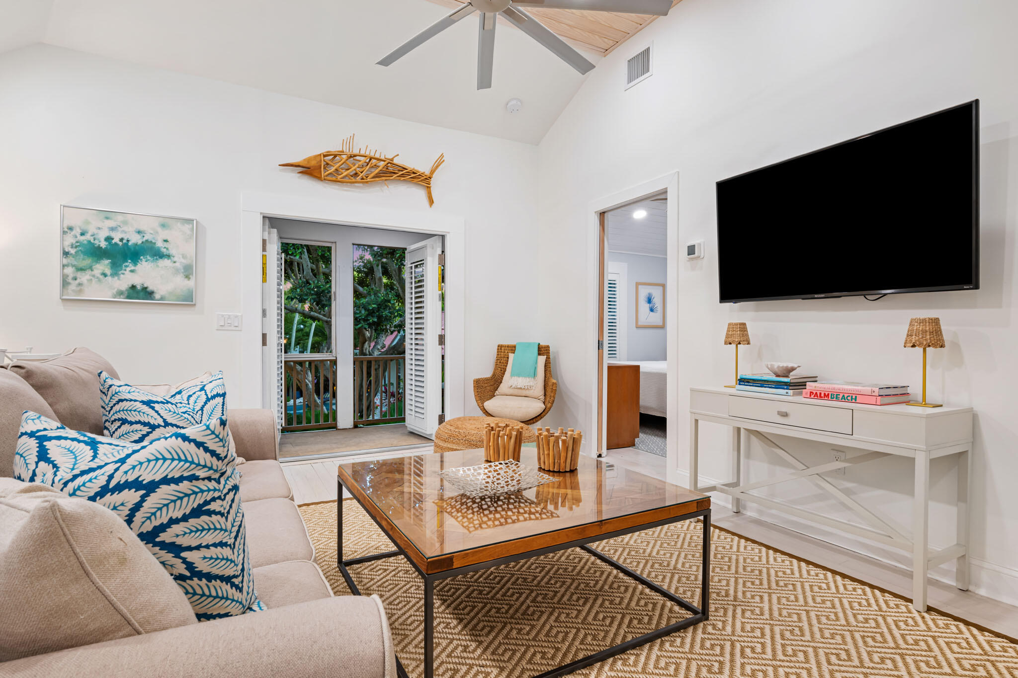 235 Dyer Road, Unit TREEHOUSE West Palm Beach, FL 33405 - Photo 10 of 20 a living room with furniture and a flat screen tv