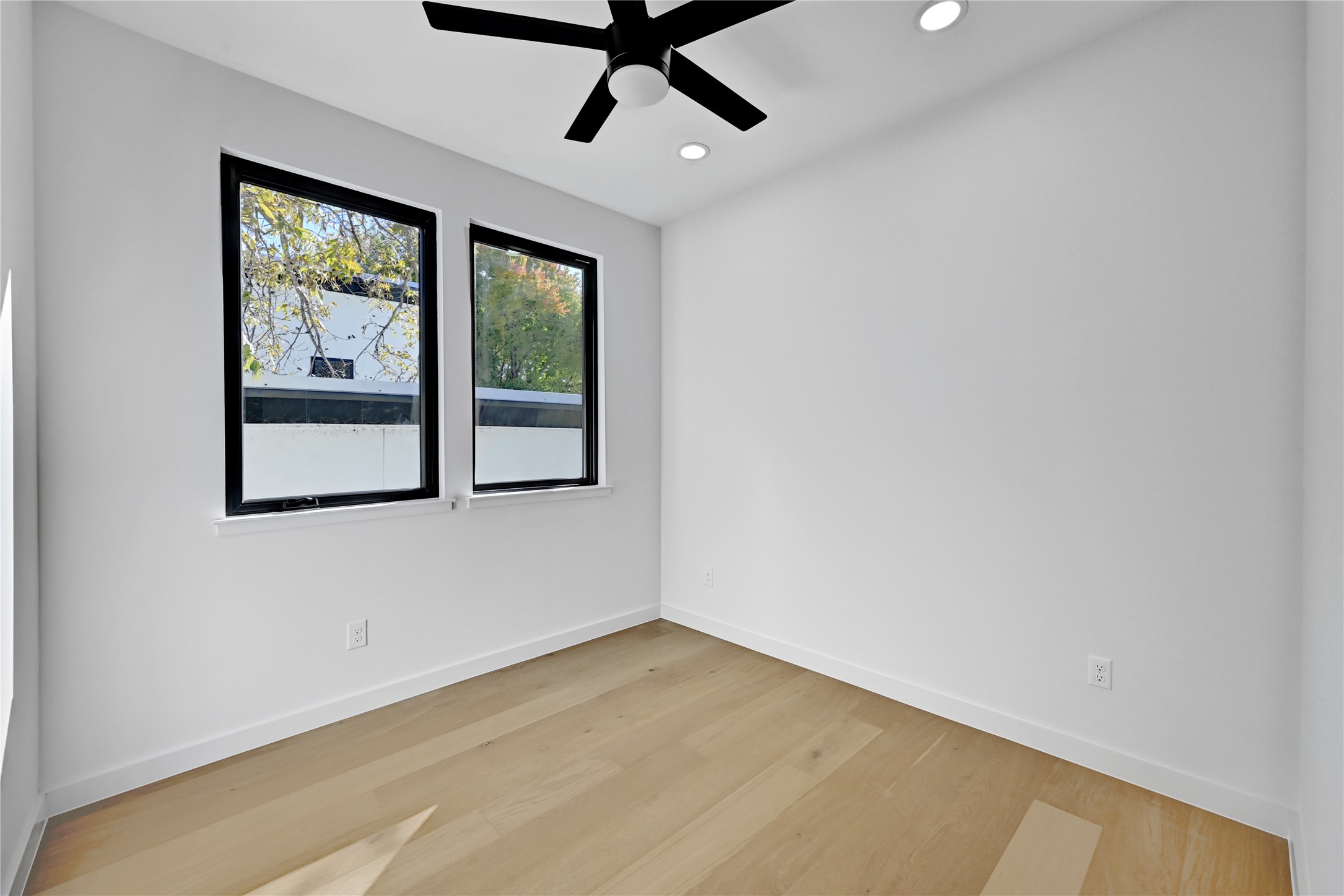 2717 Lyons Road, Unit 1 Austin, TX 78702 - Photo 22 of 34 Unfurnished room with light wood-style flooring, ceiling fan, and recessed lighting