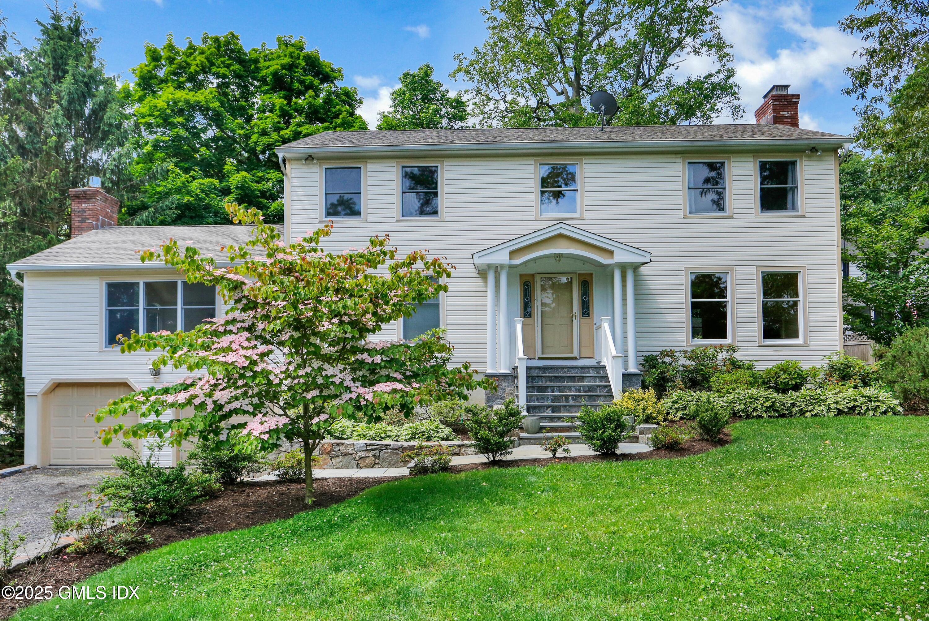 6 Coventry Lane Riverside, CT 06878 - Photo 1 of 18 front view of a house with a yard