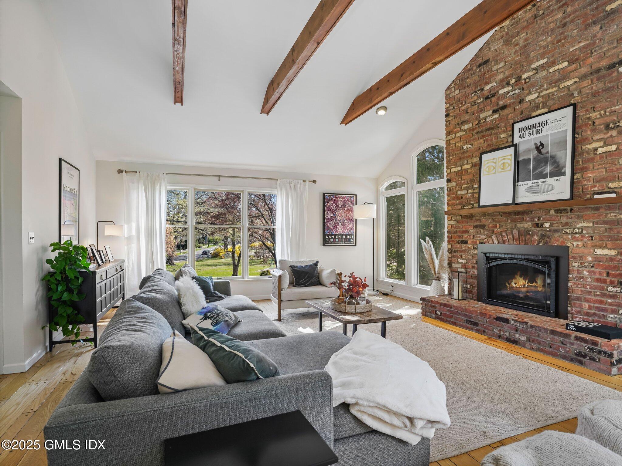 6 Coventry Lane Riverside, CT 06878 - Photo 11 of 18 a living room with furniture fireplace and potted plants