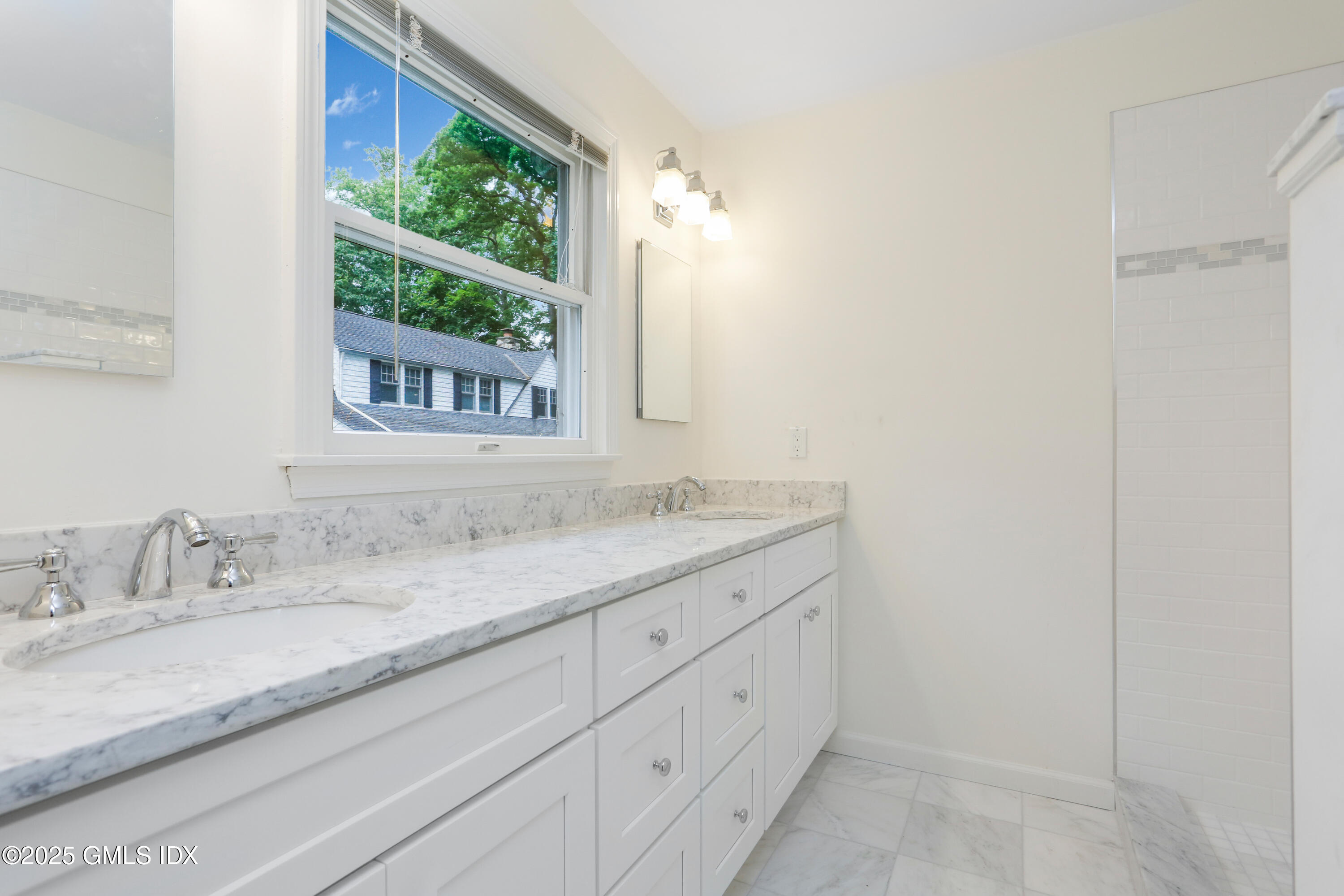 6 Coventry Lane Riverside, CT 06878 - Photo 14 of 18 a bathroom with a granite countertop sink mirror and a window