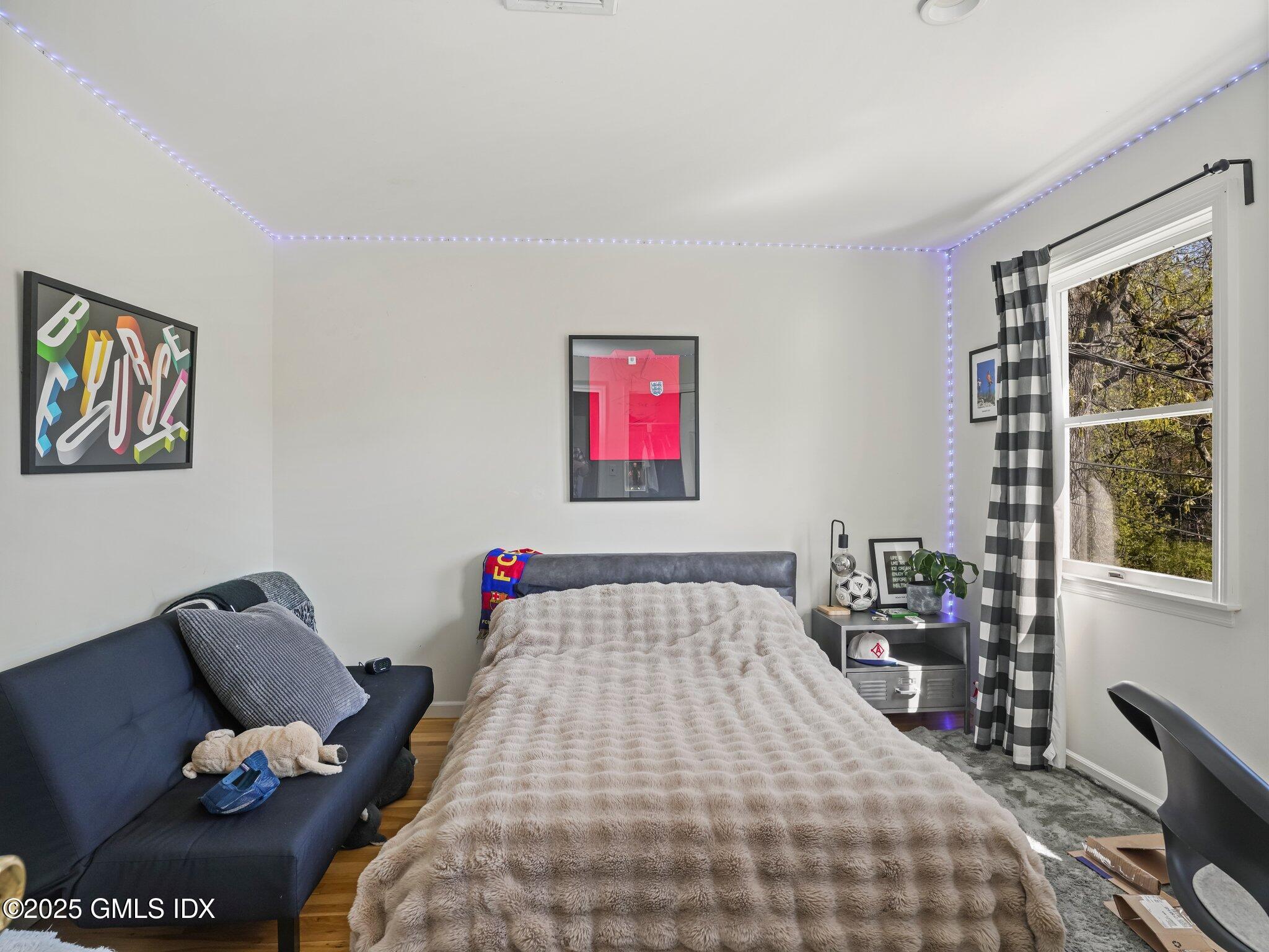 6 Coventry Lane Riverside, CT 06878 - Photo 17 of 18 a bedroom with bed and a window