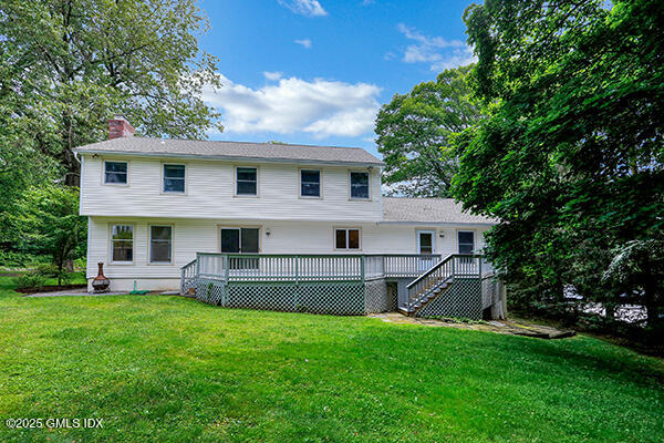 6 Coventry Lane Riverside, CT 06878 - Photo 3 of 18 a front view of a house with a garden
