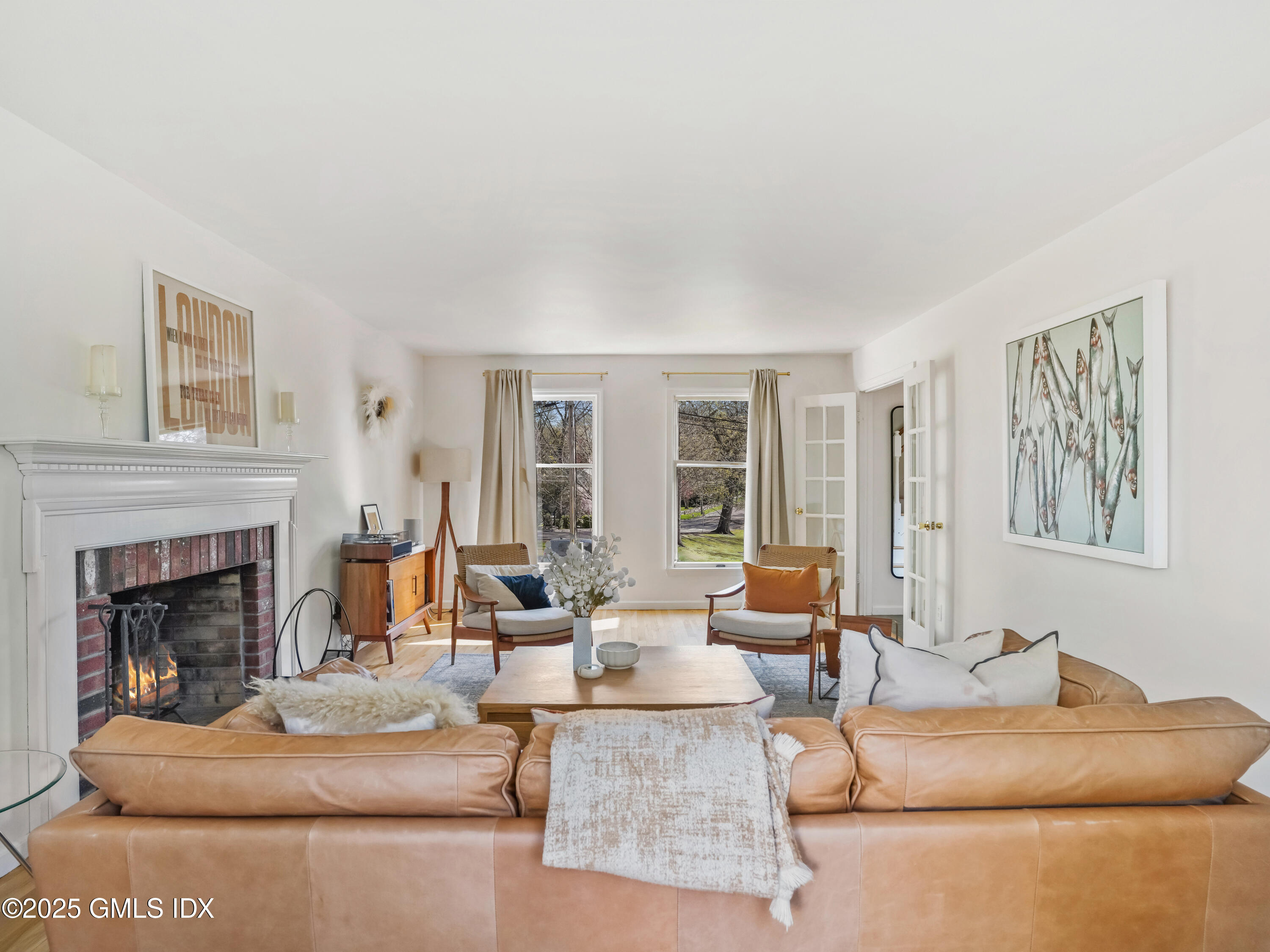 6 Coventry Lane Riverside, CT 06878 - Photo 5 of 18 a living room with furniture and a fireplace