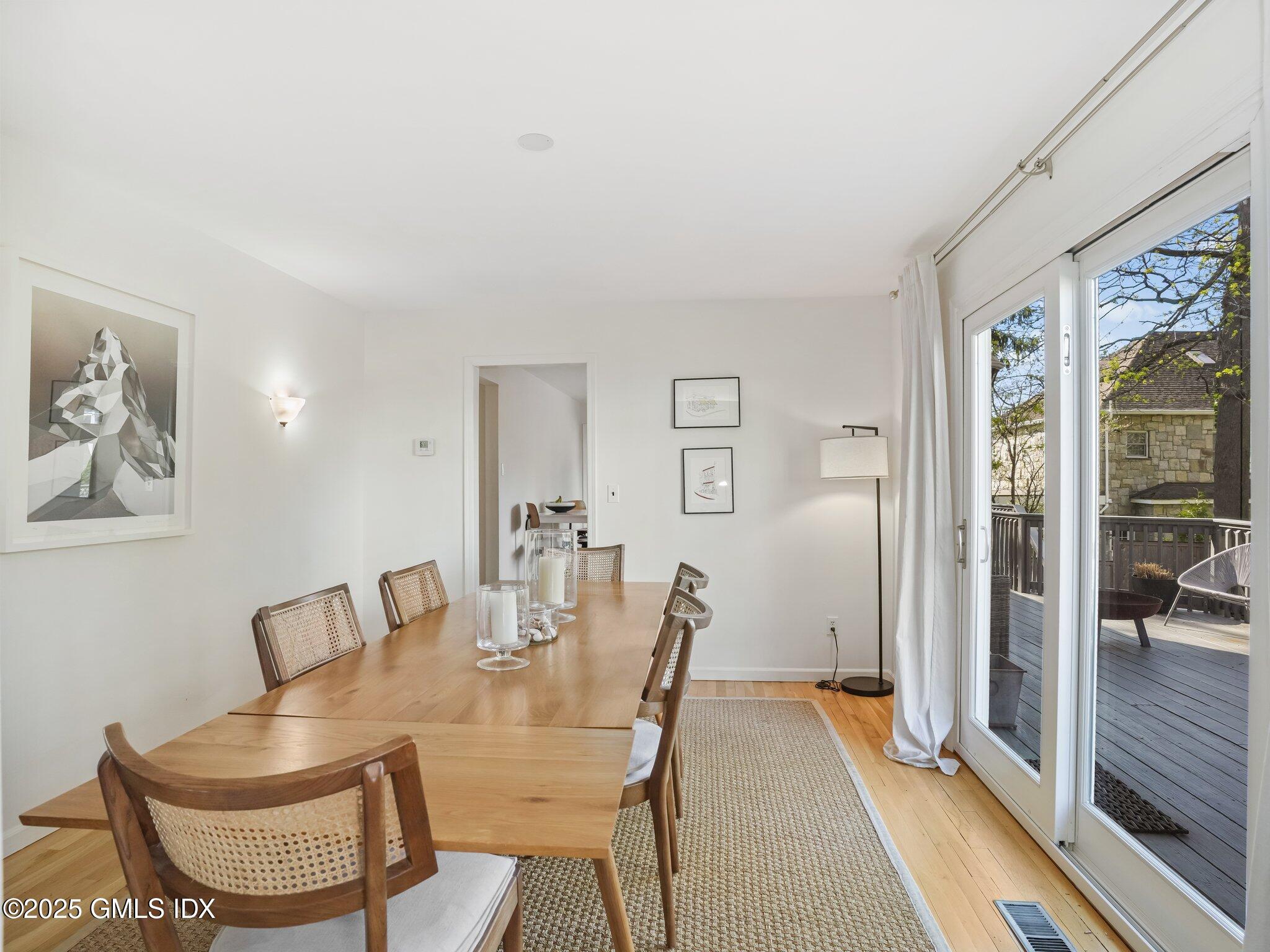 6 Coventry Lane Riverside, CT 06878 - Photo 7 of 18 a dining room with furniture and wooden floor