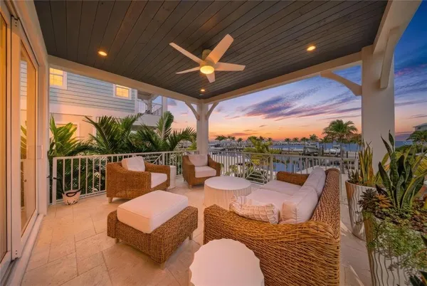 a balcony with furniture and city view