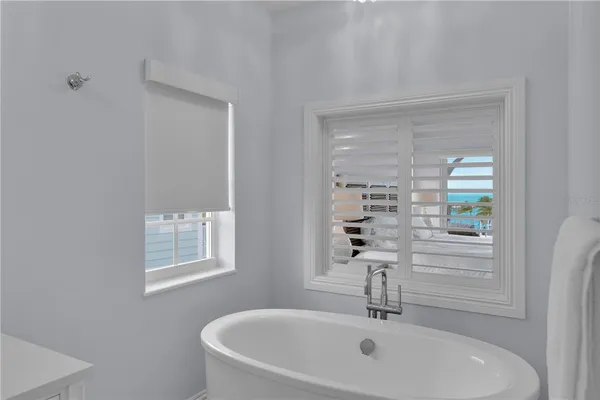 a bathroom with a shower and a window