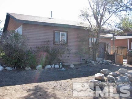 1710 Castle Way Reno, NV 89512 - Photo 1 of 1 a view of a backyard with large trees