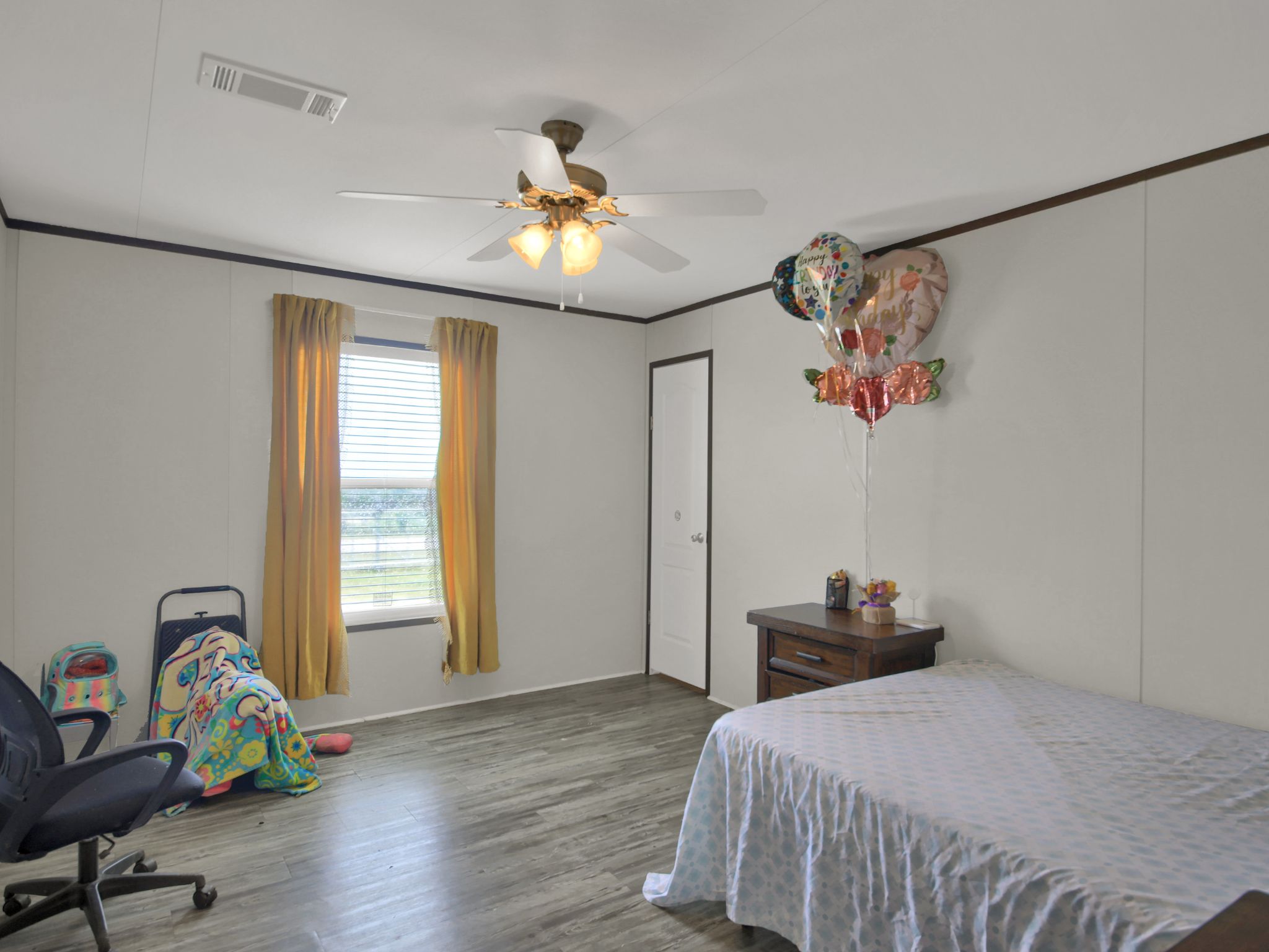 271 Alma Lane Kyle, TX 78640 - Photo 10 of 25 a bedroom with a bed and a window