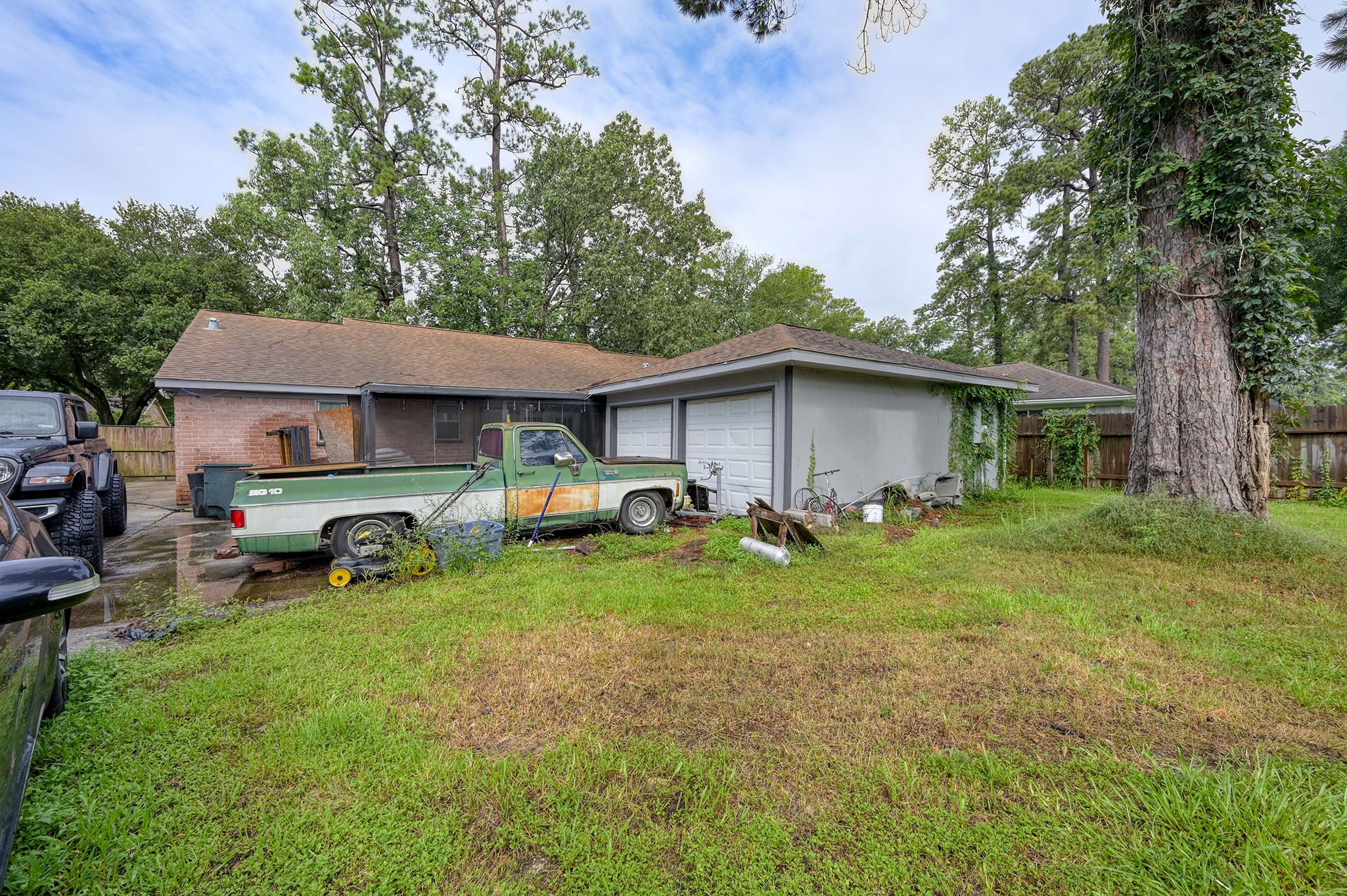25410 Pepper Ridge Lane Spring, TX 77373 - Photo 27 of 28 Two car garage is located behind the house and has a large swing gate to access from the front driveway.