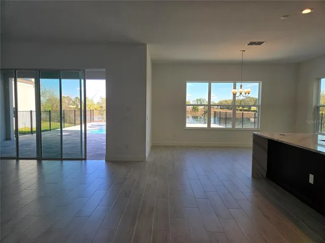 a kitchen with stainless steel appliances a sink stove and refrigerator
