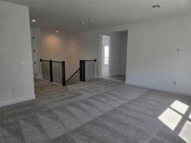 a view of balcony with wooden floor and fence