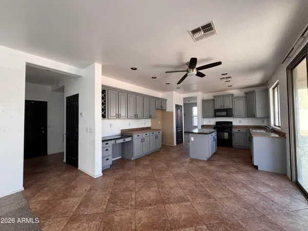 a bathroom with a granite countertop sink a toilet and a bathtub
