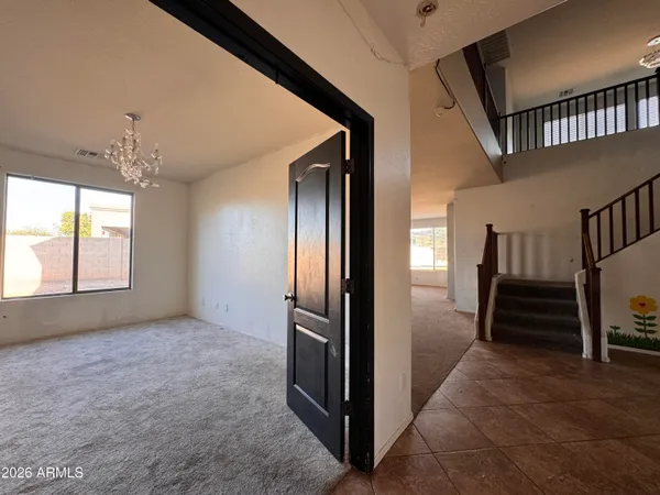 a view of an empty room with a closet