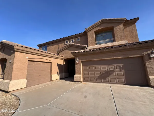 a front view of a house with a garage