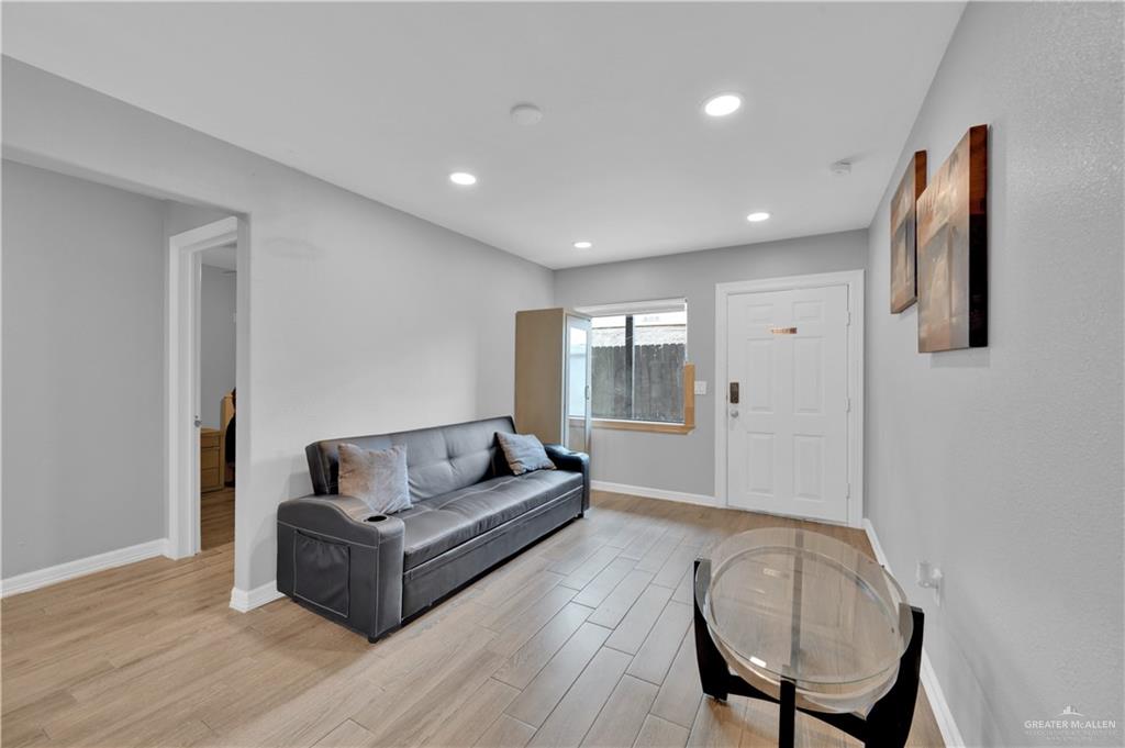 405 East Guerra Street Rio Grande City, TX 78582 - Photo 16 of 33 Living room featuring light wood-type flooring, baseboards, and recessed lighting