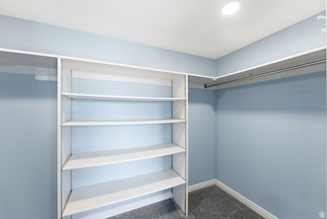 1041 West Grindelwald Court, Unit R5 Midway, UT 84049 - Photo 19 of 44 Primary closet in Midway condo for sale with built-in shelving, hanging space, and walk-in layout