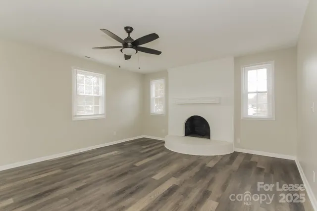 a view of a room window and wooden floor